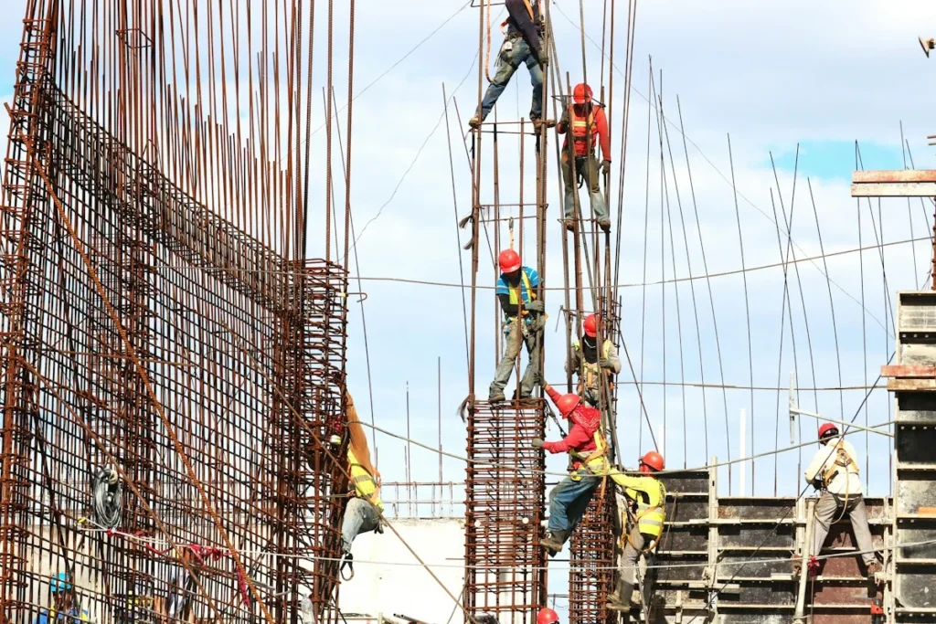 Construction workers on site – late delivery of a new apartment