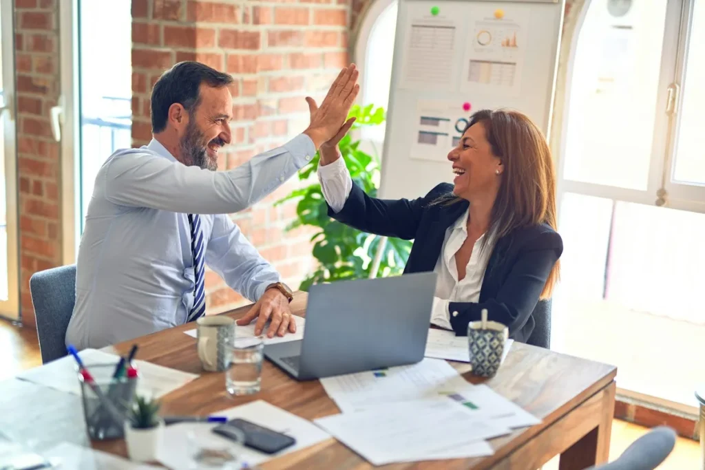 Business team celebrating – power of attorney for business owners