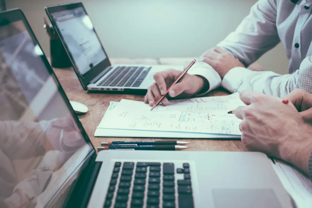 Working on documents and a laptop – regular or continuing power of attorney